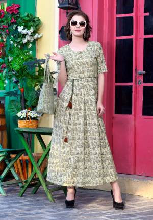 Here Is A Long Semi-Casual Kurti In Cream Color Fabricated On Khadi Cotton. This Kurti Is Beautified With Folk Prints With Musical Intruments. Buy This Unqiue Designer Kurti Now.