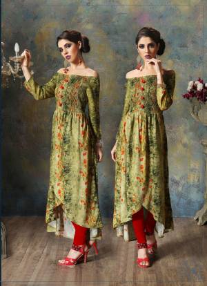 Beautiful Designer Piece Is Here With This Kurti In Green Color Fabricated On Rayon Cotton. This Kurti Is Beautified With Prints And Thread Work. It IS Durable And Easy To Care For.