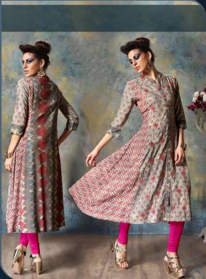 For Your Semi-Casual Wear, Here Is A Perfect Kurti In Grey Color Fabricated On Rayon Cotton. It Has Pretty Prints And Thread Work Over The Kurti. Buy It Now.