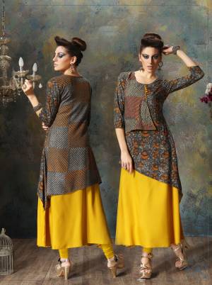 Grab This Double Layered Kurti In Dark Grey And Yellow Color Fabricated On Rayon Cotton. This Kurti Is Beautified With Intricate Detailed Prints. It Is Light Weight And Easy To Carry All Day Long.