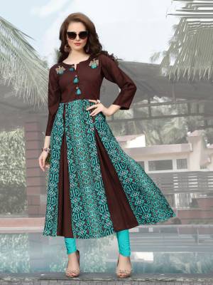 Buy This Lovely Kurti With Yoke Pattern In Brown And Blue Color Fabricated On Rayon Cotton. This Kurti Is Beautified With Prints And Embroidered Patch Work. It Is Light Weight And Easy To Carry All Day Long.