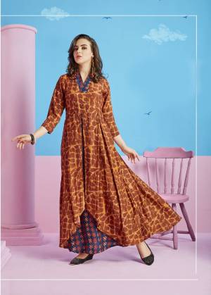 Add This Kurti to Your Wardrobe In Brown Color Fabricated On Rayon Cotton. This Kurti Is Beautified With Prints And Also It Is Soft Towards Skin And Easy To Carry All Day Long.