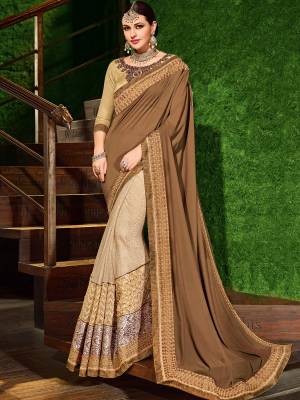 Change your wardrobe and get classier outfits like this gorgeous light brown and cream color two-tone bright georgette and jacquard border with net heavy work saree. Ideal for party, festive & social gatherings. this gorgeous saree featuring a beautiful mix of designs. Its attractive color and designer patch, stone, floral design work over the attire & contrast hemline adds to the look. Comes along with a contrast unstitched blouse.