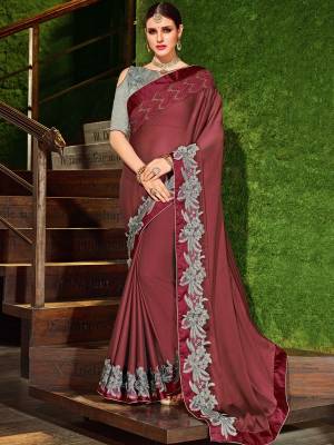 Show your elegance by wearing this gorgeous wine color bright georgette saree. Ideal for party, festive & social gatherings. this gorgeous saree featuring a beautiful mix of designs. Its attractive color and designer patch, stone, floral design work over the attire & contrast hemline adds to the look. Comes along with a contrast unstitched blouse.