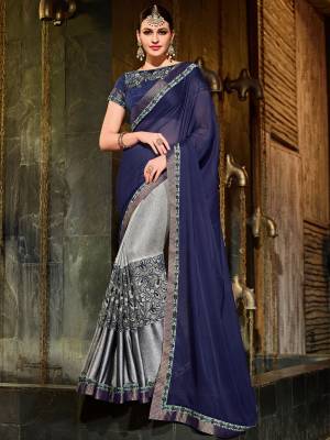 The fabulous pattern makes this saree from Indian Women a classy number to be included in your wardrobe, this navy blue and grey color moss chiffon + lycra pattern net heavy work saree. Ideal for party, festive & social gatherings. this gorgeous saree featuring a beautiful mix of designs. Its attractive color and designer patch, moti, stone, floral design work over the attire & contrast hemline adds to the look. Comes along with a contrast unstitched blouse.