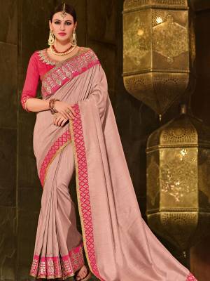 You Look elegant and stylish this festive season by draping this dusty pink color coated silk fabrics saree. Ideal for party, festive & social gatherings. this gorgeous saree featuring a beautiful mix of designs. Its attractive color and designer patch, moti, stone, floral design work over the attire & contrast hemline adds to the look. Comes along with a contrast unstitched blouse.