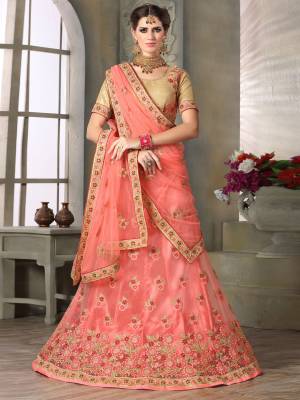 Grab This Pretty Designer Lehenga Choli In Peach Color. Its Blouse IS In Beige Color Paired With Peach Colored Lehenga And Dupatta. Its Top Is Fabricated On Art Silk Paired With Net Fabricated On Lehenga And Dupatta. Its Pretty Color And Embroidery Will MAke You Earn Lots Of Compliments From Onlookers.