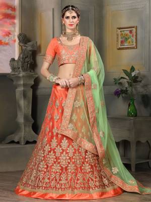 Shine Bright Wearing This Lehenga Choli In Orange Color Paired With Contrasting Light Green Colored Dupatta. Its Blouse Is Fabricated On Art Silk Paired With Net Fabricated Lehenga And Dupatta. Buy This Lehenga Choli Now.