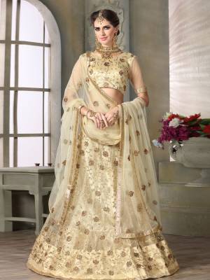 Rich Designer Lehenga Choli Is Here With This Beautiful Cream Colored Lehenga Choli. Its Blouse, Lehenga And Choli Are Fabricated On Net Which Is Light Weight And Ensures Superb Comfort All Day Long.