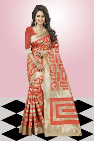 Grab This Orange And Beige Colored Saree Paired With Orange Colored Blouse. This Saree Is Fabricated On Kanjivaram Art Silk Which Is In High Demand. Grab This Pretty Saree Now.