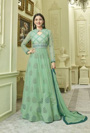 Here Is A Very Pretty Shade Of Green With This Suit In Sea Green Color Paired With Sea Green Colored Bottom And Dupatta. Its Top Is Fabricated On Art Silk And Net Paired With Art Silk Lehenga And Chiffon Dupatta. This Designer Will Definitely Earn You Lots Of Compliments From Onlookers.