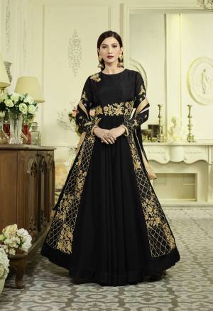 Enhance Your Beauty Wearing This Designer Floor Length Suit In Black Color Paired With Black Colored Bottom And Dupatta. Its Top Is Fabricated On Georgette Paired With Santoon Bottom And Chiffon Dupatta. It Has Attractive Golden Colored Embroidery Which Is The Main Highlight Of This Suit. Buy This Suit Now.