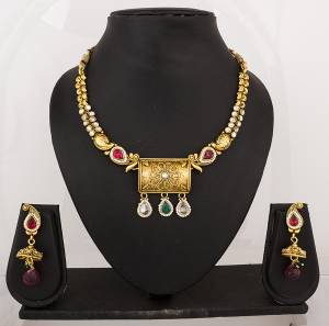 Feel Like A Queen Wearing This Rich And Elegant Necklace Set In Golden Color Beautified With Multi Colored Stones. It Is Light In Weight And Easy To Carry All Day Long.