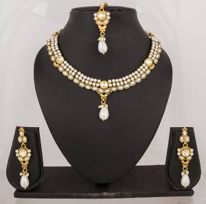 For That White Colored Dress, Here Is The Perfect Necklace Set In Golden Color Beautified with Pearls all Over. Pair This Up With White OR Any Colored Attire. Buy Now.
