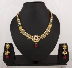 Grab This Simple Necklace Set In Golden Color With Kundan And Multi Colored Stones. This Can Be Paired With Banarasi Saree For Very Attractive Look.