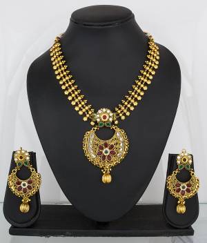 Feel Like A Queen Wearing This Rich And Elegant Necklace Set In Golden Color Beautified With Multi Colored Stones. It Is Light In Weight And Easy To Carry All Day Long.