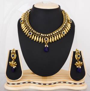 Earn Lots Of Compliments Wearing This Attractive Necklace Set In Golden Color Beautified with Navy Blue Colored Stone Work. This Can be Paired With Navy Blue Or Any Contrasting Colored Attire. Buy Now.