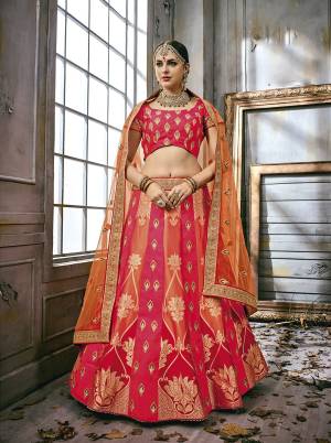 Attract All Wearing This Designer Lehenga Choli In Dark Pink Colored Blouse Paired With Dark Pink And Orange Colored Lehenga And Orange Colored Dupatta. This Lehenga And Choli Are Fabricated On Art Silk Paired With Net Fabricated Dupatta. It Has Heavy Embroidery All Over Which Is Making This Lehenga Choli More Pretty.