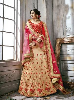 Adorn The Rich and Royal Look Of The Season Wearing This Designer Lehenga Choli In Red Colored Blouse Paired With Beige Colored Lehenga And Pink Colored Dupatta. Its Lehenga And Choli Are Fabricated On Satin Silk Paired With Net Fabricated Dupatta. It Also Ensures Superb Comfort All Day Long.