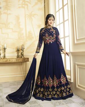 For A Rich And Elegant Look, Grab This Designer Floor Length Suit In Navy Blue Color Paired With Navy Blue Colored Bottom And Dupatta. Its Top Is Fabricated On Georgette Paired With Santoon Bottom And Chiffon Dupatta. Its Yoke And Panel Is Beautified With Heavy detailed Embroidery Which IS Making The Suit More Attractive. Buy It Now.