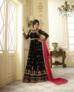 Enhance Your Beauty Wearing this Black Colored Designer Floor Length Suit Paired With Black Colored Bottom And Contrasting Pink Colored Dupatta. Its Top Is Fabricated On Georgette Paired With Santoon Bottom And Chiffon Dupatta. You Will Definitely Earn Lots Of Compliments From Onlookers.