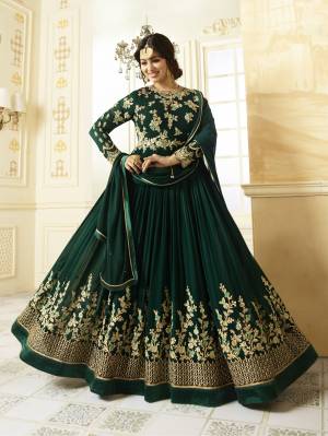 Celebrate This Festive Season Wearing This Designer Floor Length Suit In Pine Green Color Paired With Pine Green Colored Bottom And Dupatta. Its Top Is Fabricated On Georgette Paired With Santoon Bottom And Chiffon Dupatta. This Suit Will Definitely Earn You Lots Of Compliments From Onlookers. Buy This Suit Now.