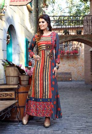 For Your Semi-Casual Wear, Here Is A Perfect Kurti In Multi Color Fabricated On Cotton Beautified With Multi Colored Prints And Fabrics. This Kurti Ensures Superb Comfort All Day Long. Buy Now.