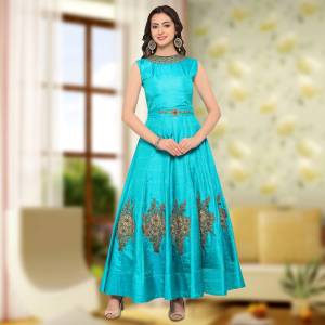 Look Pretty In This Sky Blue Colored Gown Fabricated On Art Silk. This Semi-Stitched Gown 