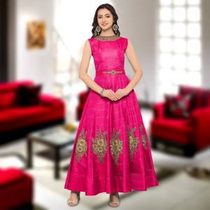 Attract All Wearing This Attractive Gown In Fuschia Pink Color. This Gown Is Fabricated On Art Silk Beautified With Embroidered Patch Work And Neckline. Buy This Semi-Stitched Gown Now.
