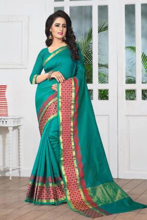 Here Is A Beautiful Shade Of Green With This Teal Green colored Saree Paired With Teal Green Colored Blouse. This Saree And Blouse Are Fabricated On Banarasi Art Silk Which Gives a Rich Look To Your Personality. Buy Now.