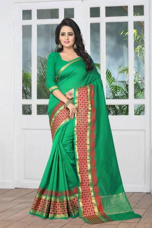 Add This Simple Saree In Green Color Paired With Green Colored Blouse. This Saree And Blouse Are Fabricated On Banarasi Art Silk Beautified With Contrasting Red Colored Weave Over The Saree Border. Buy Now.
