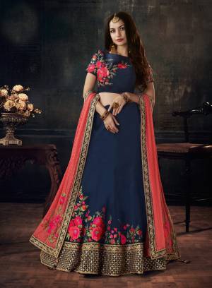 Give Your Personality A Bold Look Wearing This Designer Lehenga Choli In Blue Color Paired With Contrasting Dark Peach Colored Dupatta. Its Blouse And Lehenga Are Fabricated On Tafeta Art Silk Paired With Lycra Net Fabricated Dupatta. It Has Pretty Floral Embroidery Over Its Lehenga And Choli. 