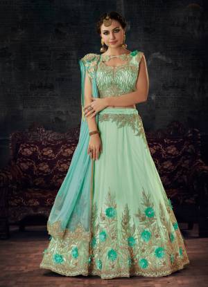 This Season Is About Subtle Shades And Pastel Play, so Grab This Designer Lehenga Choli In Pastel Green Color Paired With Sky Blue Colored Dupatta. Its Lehenga And Choli Are Fabricated On Net Paired With Fancy Net Dupatta. All Three Fabrics Are Light Weight And Ensures Superb Comfort All Day Long.