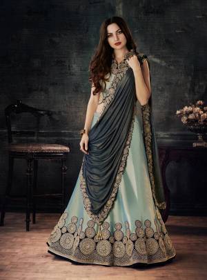 Rich And Elegant Looking Designer Lehenga Choli Is Here In Baby Blue Color Paired With Navy Blue Colored Dupatta. Its Blouse And Lehenga Are Fabricated On Tafeta Art Silk Paired With Lycra Fabricated Dupatta. Buy It Now.