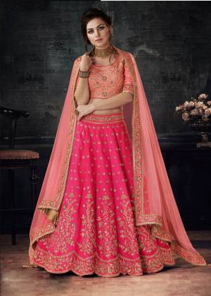 Look Pretty In This Beautiful And Heavy Designer Lehenga Choli In Peach Colored Blouse And Dupatta Paired With Fuschia Pink Colored Lehenga. Its Lehenga And Blouse Are Fabricated On Art Silk Paired With Net Fabricated Dupatta. Buy It Now.