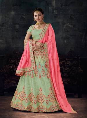 This Season Is About Subtle Shades And Pastel Play, so Grab This Designer Lehenga Choli In Pastel Green Color Paired With Contrasting Pink Colored Dupatta. Its Lehenga And Choli Are Fabricated On Art Silk Paired With Soft Silk Dupatta. All Three Fabrics Are Light Weight And Ensures Superb Comfort All Day Long.