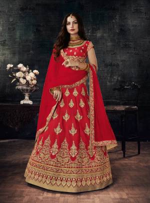 Adorn The Lovely Angelic Look Wearing This Red Colored Lehenga Choli Paired With Red Colored Dupatta. Its Lehenga And Choli Are Fabricated On Art Silk Paired With Net Fabricated Dupatta. This Lehenga Choli Will Definitely Earn You Lots Of Compliments From Onlookers.