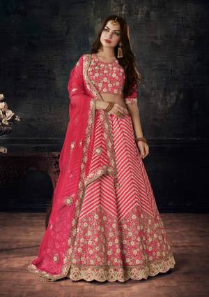 This Wedding Season, Catch All The Limelight At The Next You Attend Wearing This Designer Lehenga Choli In Pink color. Its Blouse And Lehenga Are Fabricated On Art Silk Paired With Net Fabricated Dupatta. Its Heavy Embroidery And Rich Fabric Will Earn You Lots Of Compliments From Onlookers. Buy Now.