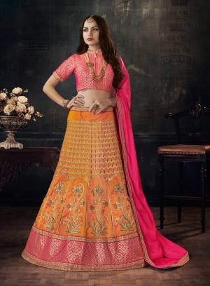 Go Colorful Wearing This Designer Lehenga Choli In Fuschia Pink Colored Blouse And Dupatta Paired With Contrasting Yellow Colored Lehenga. Its Blouse Is Fabricated On Brocade Paired With Art Silk Lehenga and Soft Silk Dupatta. Its Beautiful Color Combination Will Make You Look The Most Attractive Of All.