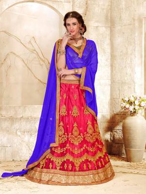 Go Colorful Wearing This Attractive Combination Lehenga Choli In Golden Colored Blouse Paired With Dark Pink Colored Lehenga And Contrasting Violet Colored Dupatta. Its Blouse Is Fabricated On Gota Silk Paired With Net Fabricated Lehenga And Chiffon Dupatta. 