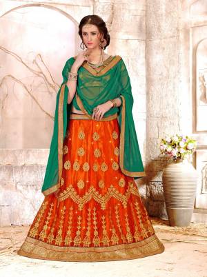 Celebrate This Festive Season Wearing This Lehenga Choli In Golden Colored Blouse Paired With Orange Colored Lehenga And Green Colored Dupatta. Its Blouse Is Fabricated On Gota Silk Paired With Net Lehenga And Chiffon Dupatta. Its All Three Fabrics Are Light Weight And Easy To Carry All Day Long.