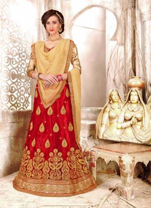 Grab This Beautiful Lehenga Choli In Golden Colored Blouse Paired With Red Colored Lehenga And Beige Colored Dupatta. Its Blouse Is Fabricated On Gota Silk Paired With Net Lehenga And Chiffon Dupatta. This Evergreen Combination And Embroidery Will Earn You Lots Of Compliments From Onlookers.
