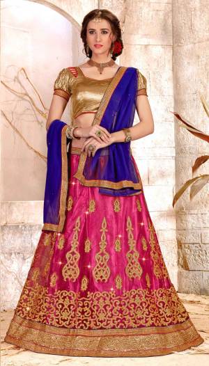 Go Colorful Wearing This Attractive Combination Lehenga Choli In Golden Colored Blouse Paired With Magenta Pink Colored Lehenga And Contrasting Violet Colored Dupatta. Its Blouse Is Fabricated On Gota Silk Paired With Net Fabricated Lehenga And Chiffon Dupatta. 