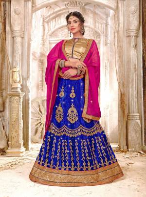 Shine Bright Wearing This Attractive Colored Lehenga Choli In Golden Colored Blouse Paired With Royal Blue Colored Lehenga And Dark Pink Colored Dupatta. Its Blouse Is Fabricated On Gota Silk Paired With Net Lehenga And Chiffon Dupatta. Buy This Lehenga Choli Now.