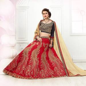 This Wedding Season Catch All The Limelight Wearing This Designer Lehenga Choli In Navy Blue Colored Blouse Paired With Red Colored Lehenga And Beige Colored Dupatta. Its Lehenga And Choli Are Fabricated On Art Silk Paired With Net Fabricated Dupatta. It Also Has Heavy Embroidery All Over It. Buy This Lehenga Choli Now.