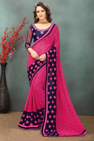 Gra This Saree For Your Casual Wear In Dark Pink Color Paired With Contrasting Navy Blue Colored Blouse.This Saree Is Fabricated On Georgette Paired With Art Silk And Net Fabricated Blouse. It Is Beautified With Prints And Thread Work. Buy This Saree Now.