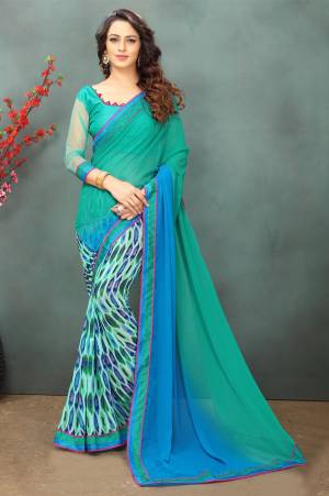 Cool Color Pallete Saree Is Here In Sea Green And Blue color Paired With Sea Green Colored Blouse. This Saree Is Fabricated On Georgette Paired With Art Silk And Net Fabricated Blouse. It Is Beautified With Prints And Thread Work. 