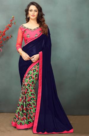 Go Colorful Wearing This Saree In Navy Blue And Multi Color Paired With Contrasting Pink Colored Blouse. This Saree Is Fabricated On Georgette Paired With Art Silk And Net Fabricated Blouse. This Saree Is Light Weight And Gives You A Pretty Look Like Nevery Before.
