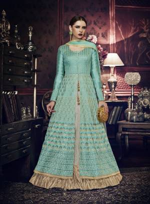 Look Pretty Wearing This Aqua Blue Colored Designer Suit Paired With Grey Colored Bottom And Aqua Blue Colored Dupatta. Its Top Is Fabricated On Art Silk Paired With Santoon Bottom And Chiffon Dupatta. It Is Beautified With Embroidery All Over The Top. Buy This Designer Suit Now.