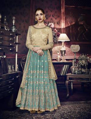 Here Is Beautiful Designer Floor Length Suit In Aqua Blue And Beige Color Paired With Aqua Blue Colored Bottom And Beige Colored Dupatta. Its Top Is Fabricated On Art Silk Paired With Santoon Bottom And Chiffon Dupatta. This Lovely Suit Will Definetly Earn You Lots Of Compliments From Onlookers.